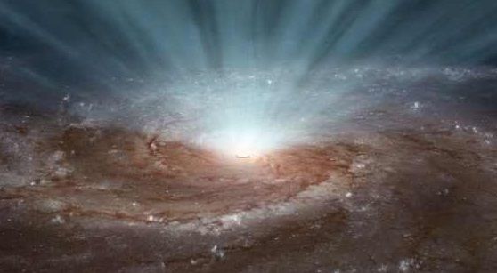 Vantul cosmic generat de o gaura neagra uriasa poate schimba soarta unei intregi galaxii