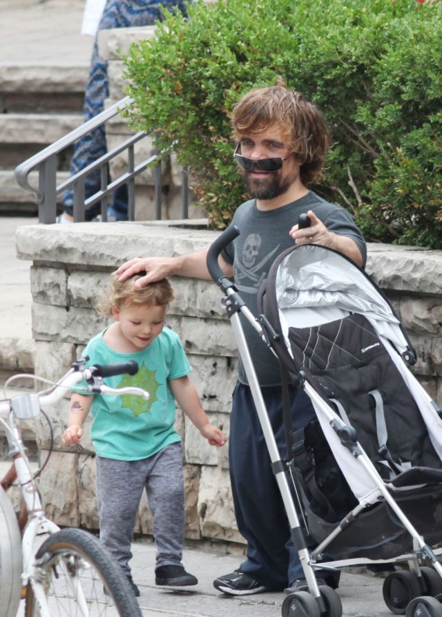 EXCLUSIVE: 'Game Of Thrones' actor Peter Dinklage and his wife Erica Schmidt take their daughter Zelig Dinklage out for a walk in Toronto
