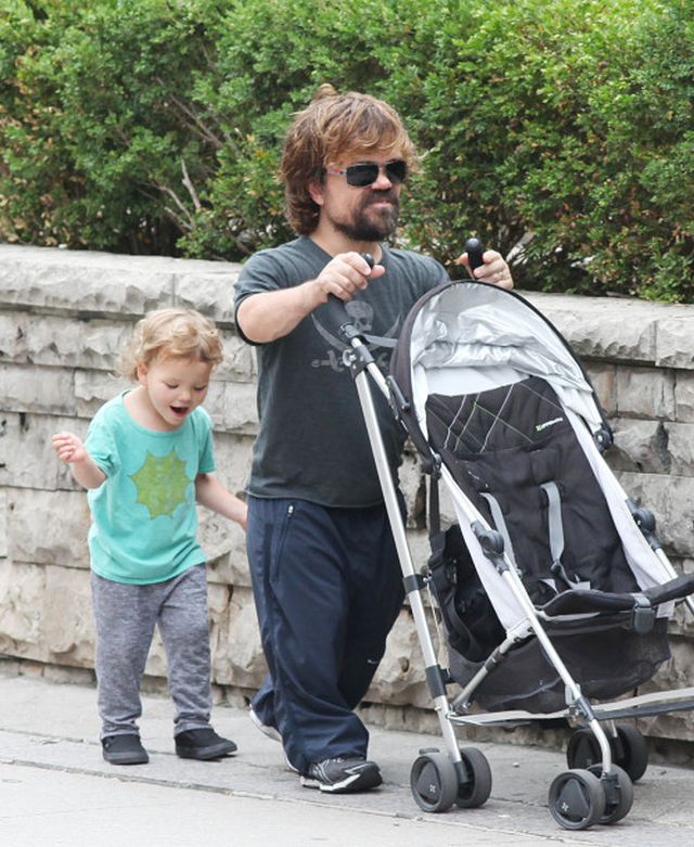 EXCLUSIVE: 'Game Of Thrones' actor Peter Dinklage and his wife Erica Schmidt take their daughter Zelig Dinklage out for a walk in Toronto